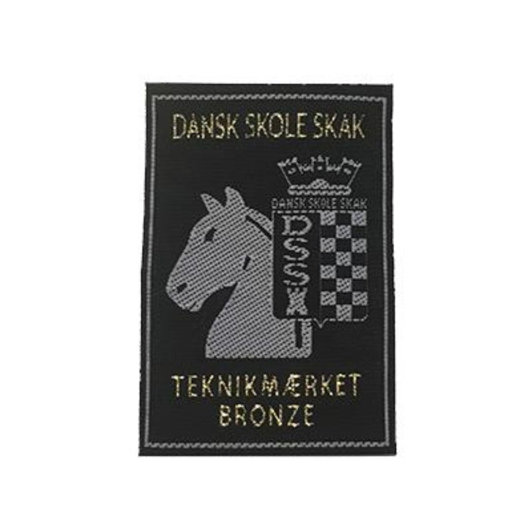 Et stofmærke der følger med diplomet for beståelse af teknikmærket bronzespringeren